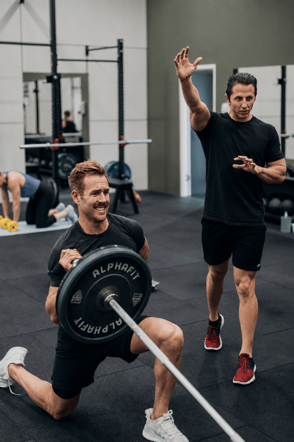Zane Pollard coaching an athlete during a strength and conditioning session